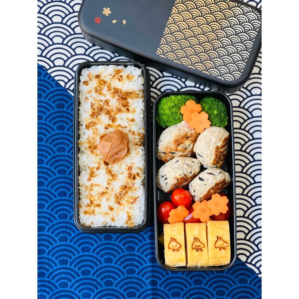 overhead shot showing packed bento in 2 layers of bento box