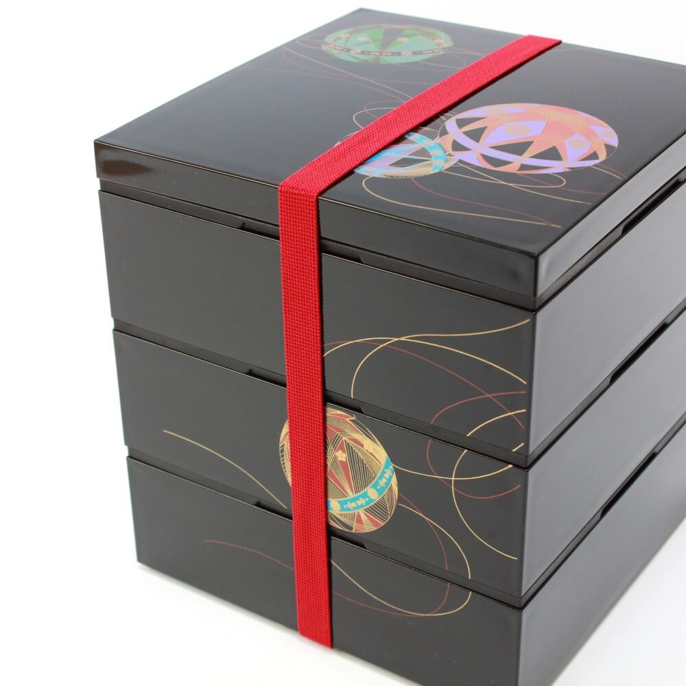 red bento band securing 3 layers temari picnic bento box