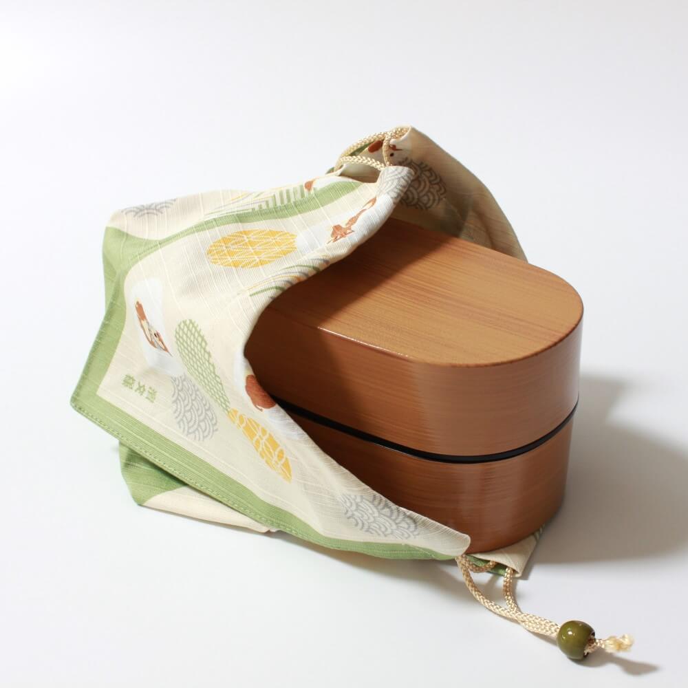 bento box halfway inside bento lunch bag
