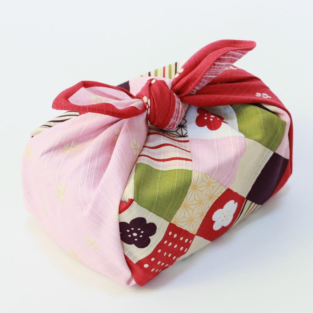 bento box wrapped in colourful ichimatsu furoshiki