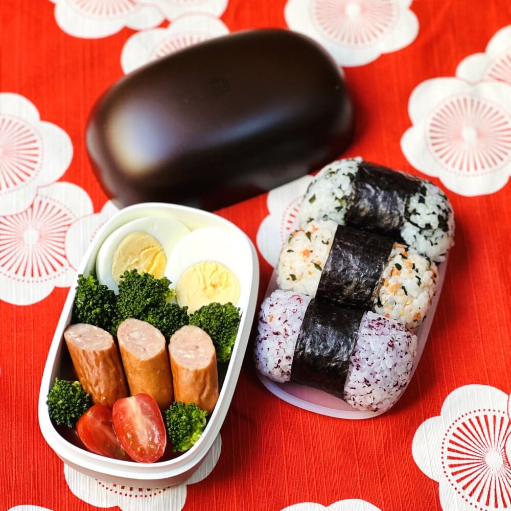 bread loaf onigiri bento box with food