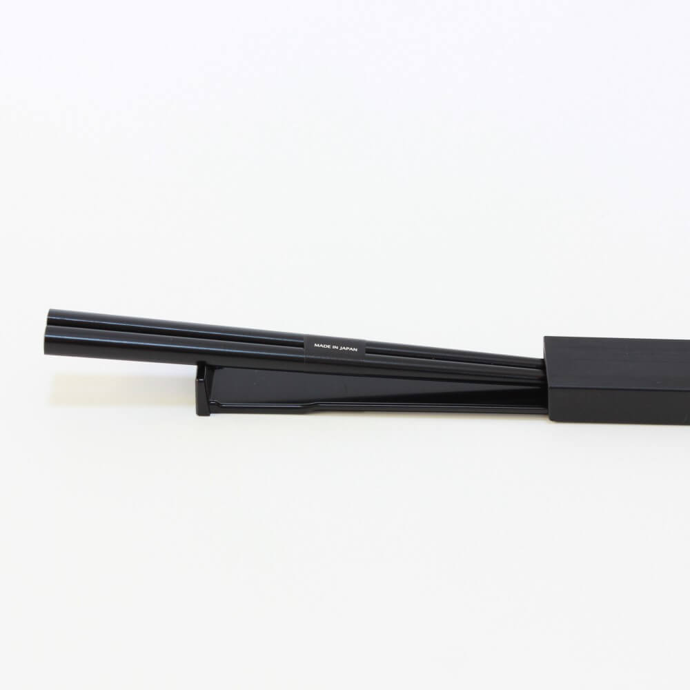 chopsticks halfway inside case