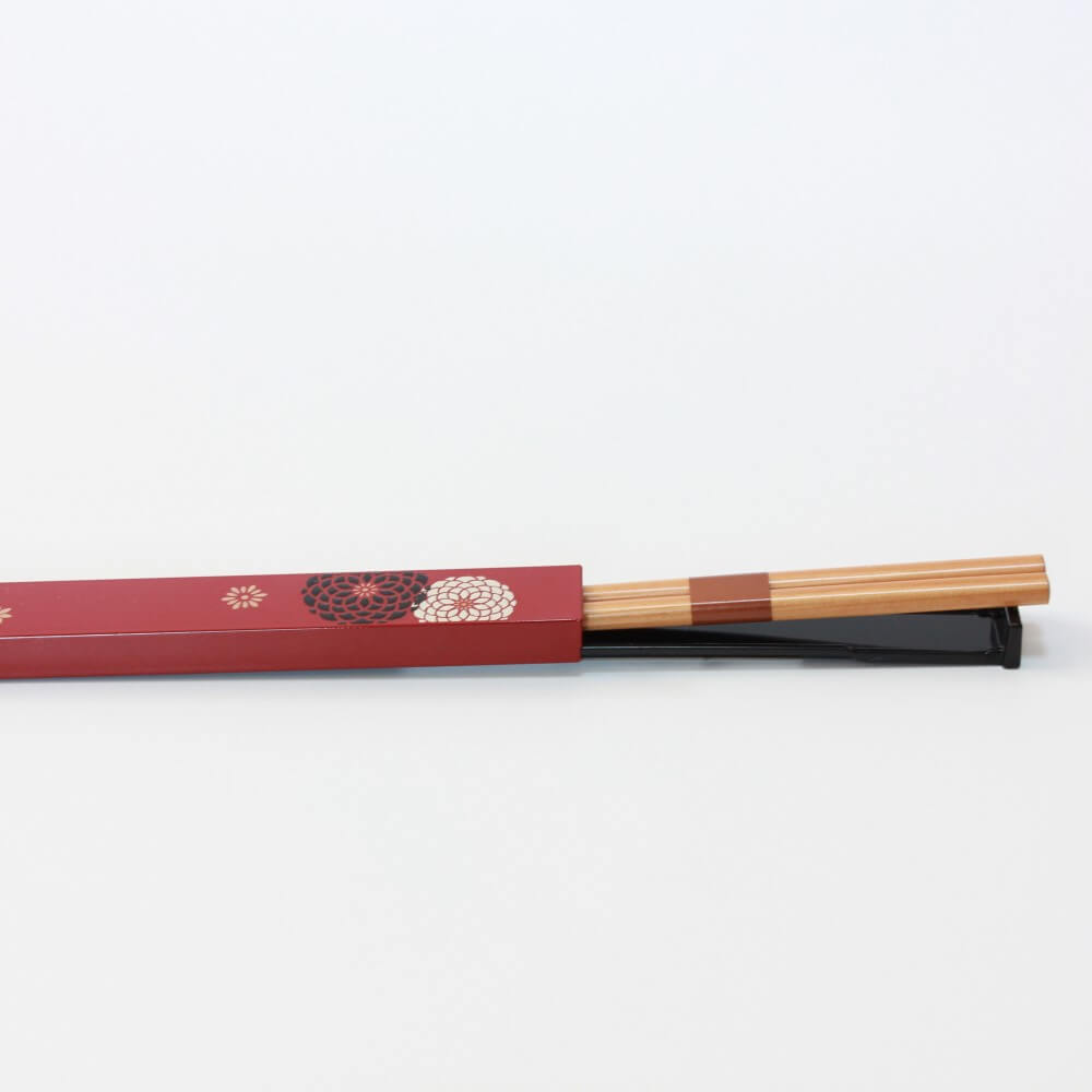 chopsticks halfway inside momoka red case