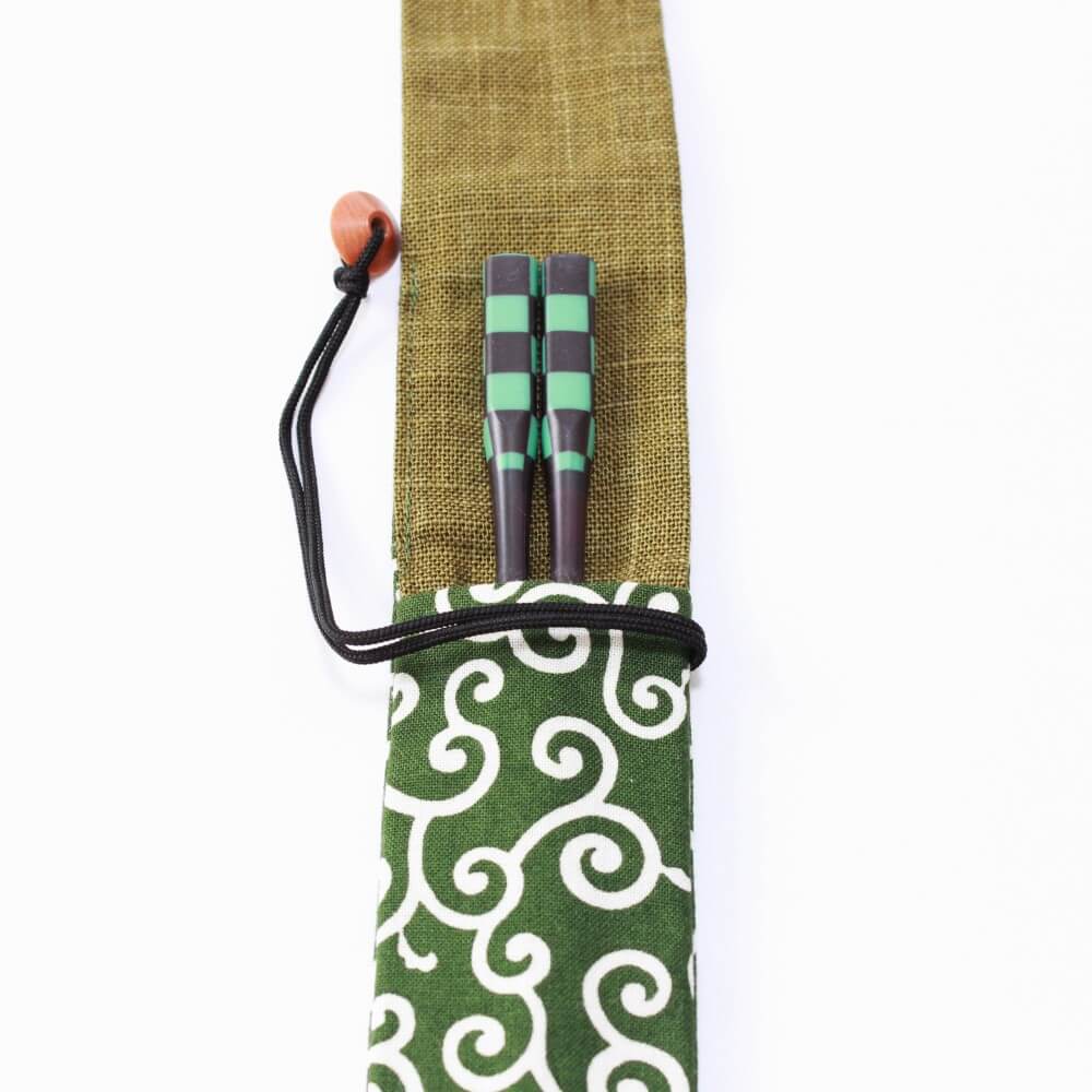 chopsticks inside karakusa green fabric case