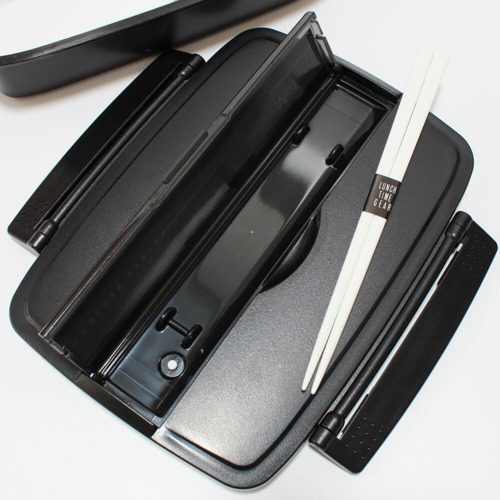 chopsticks outside its compartment on lid