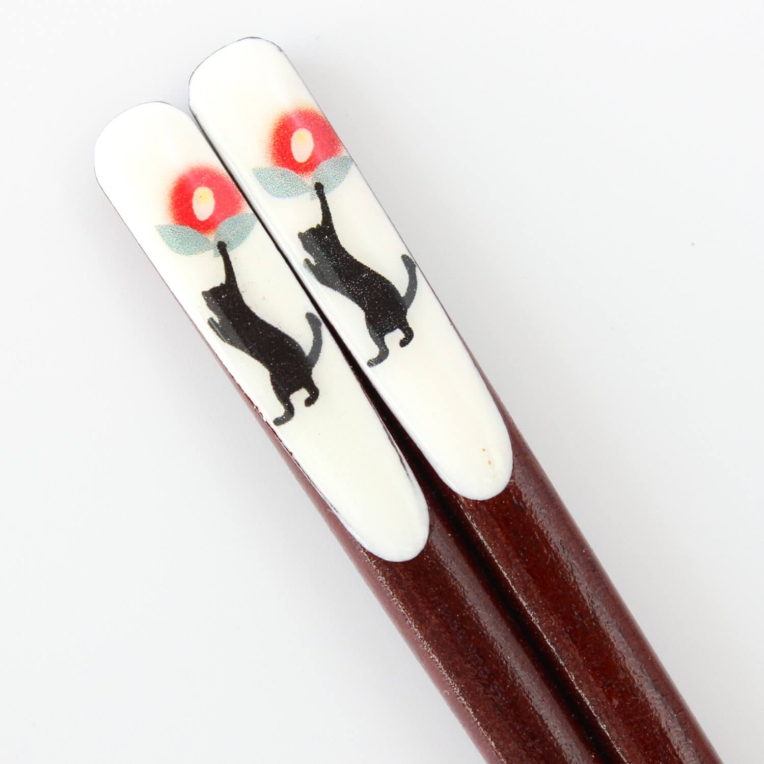 close up of chopsticks handle showing artwork