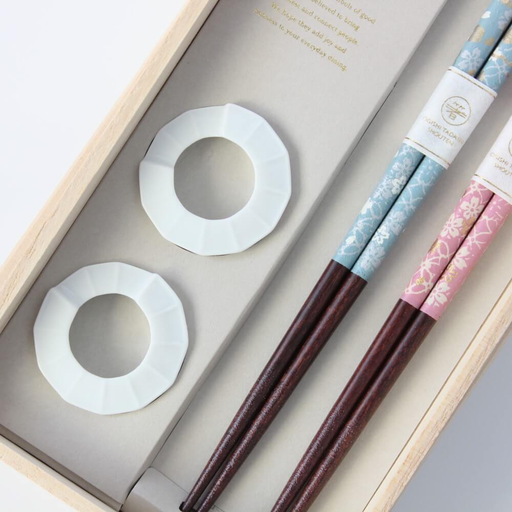 close up of chopsticks rests in chopsticks gift box with two chopsticks