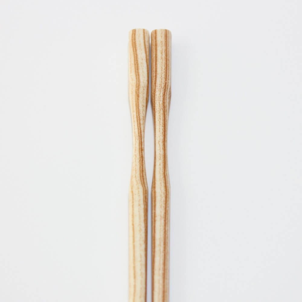 close up curved neck shiraki grain chopsticks