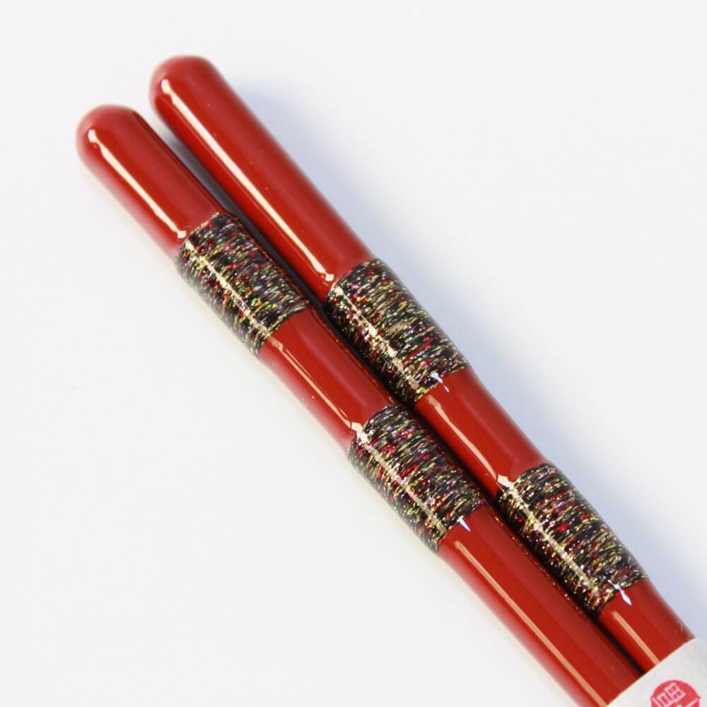 close up handles hananoito red wood chopsticks