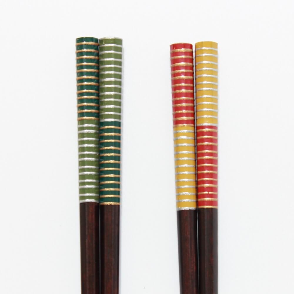 close up handles musou chopsticks green red