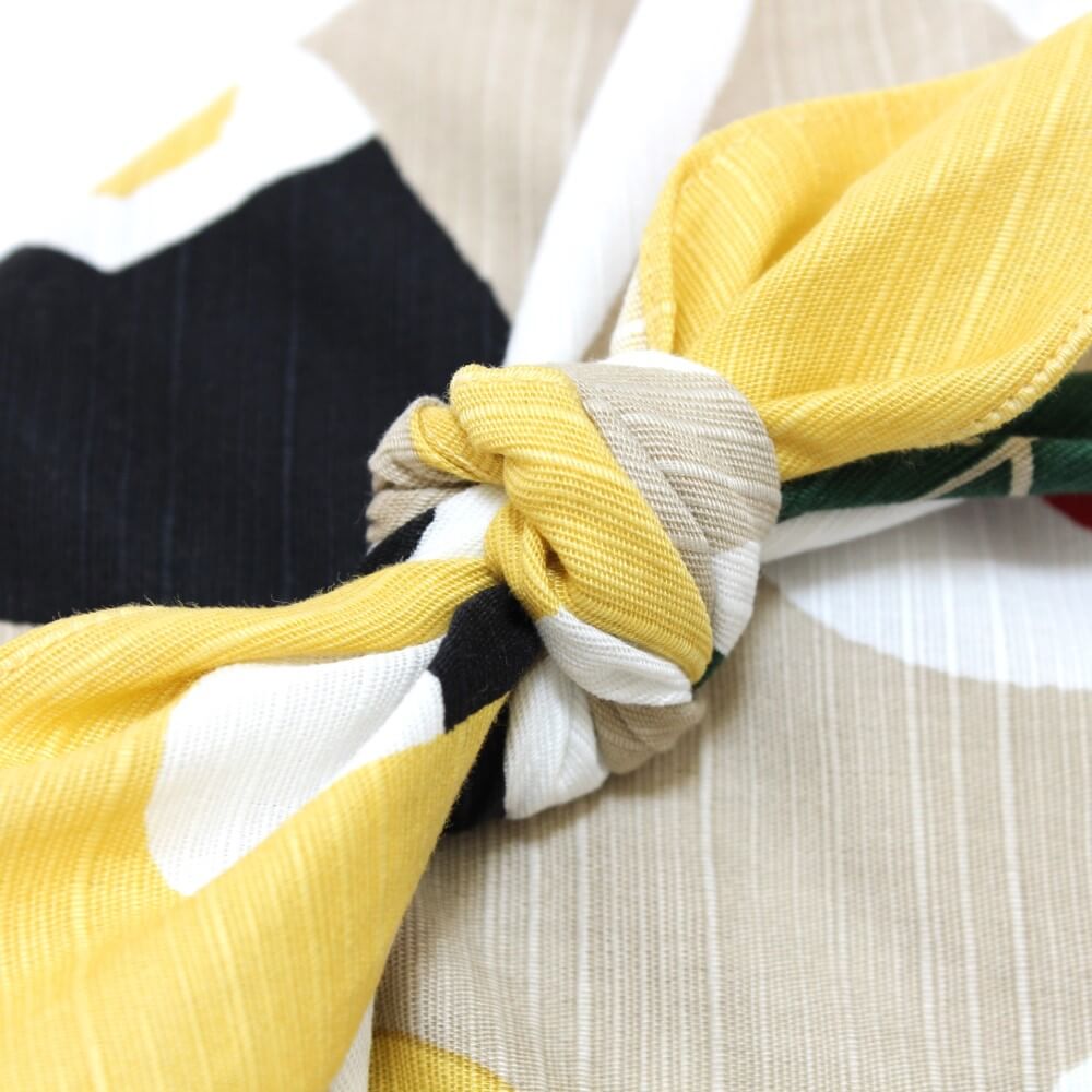 close up of the knot of onigiri tsutsumi furoshiki wrapped bento box