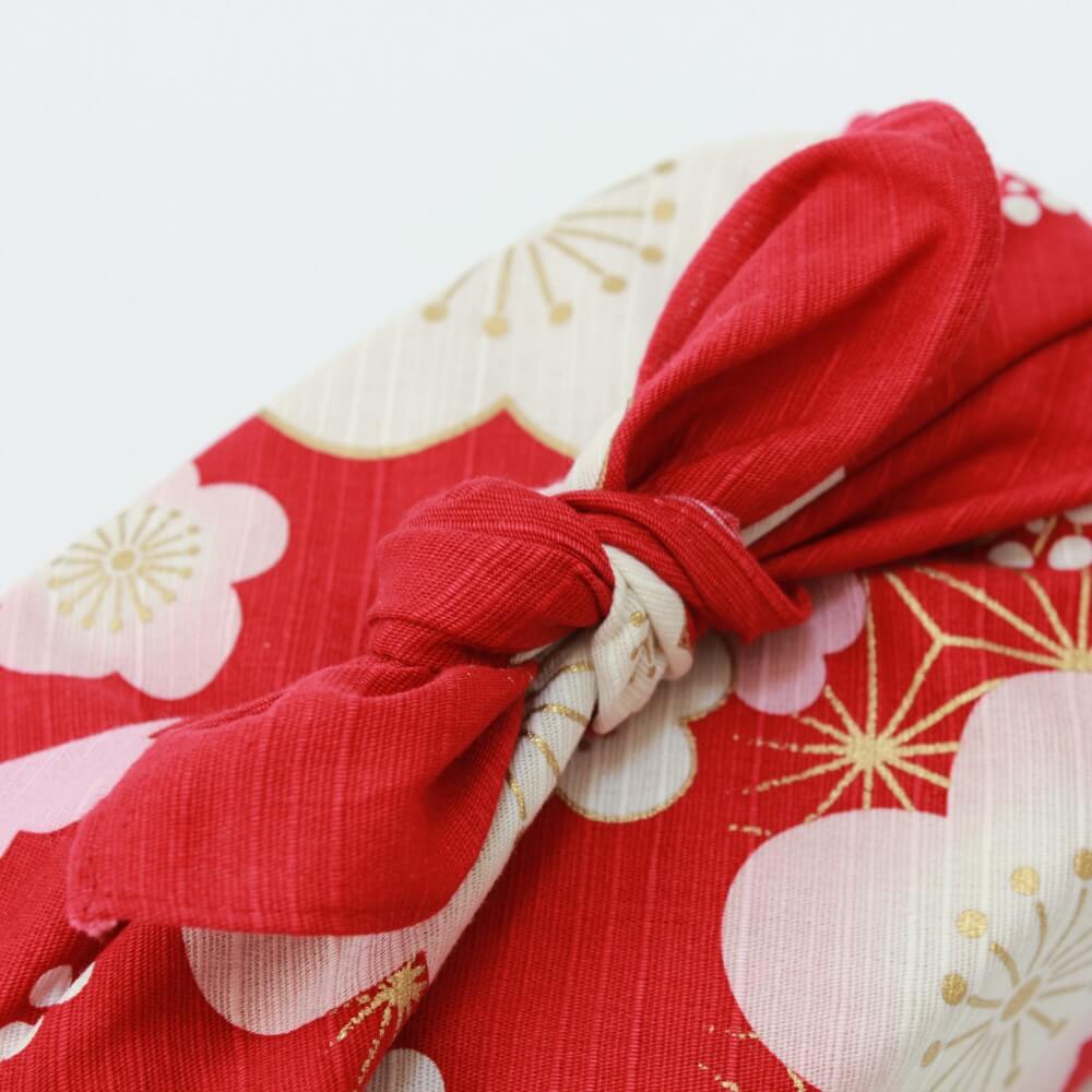 close up of knot tied red furoshiki