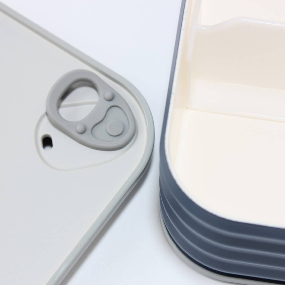 close up lid showing vent and inside navy eatcan bento box
