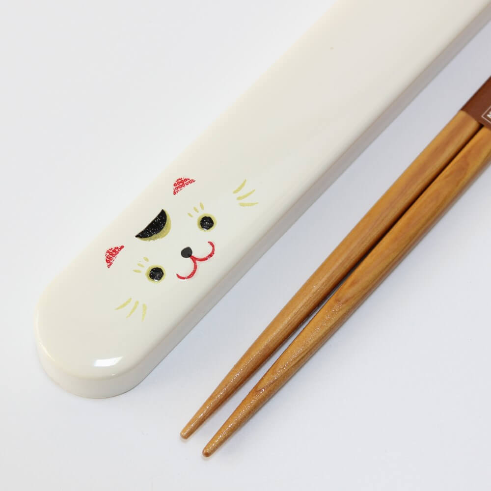 close up maneki cat chopsticks case and chopstick tips close up