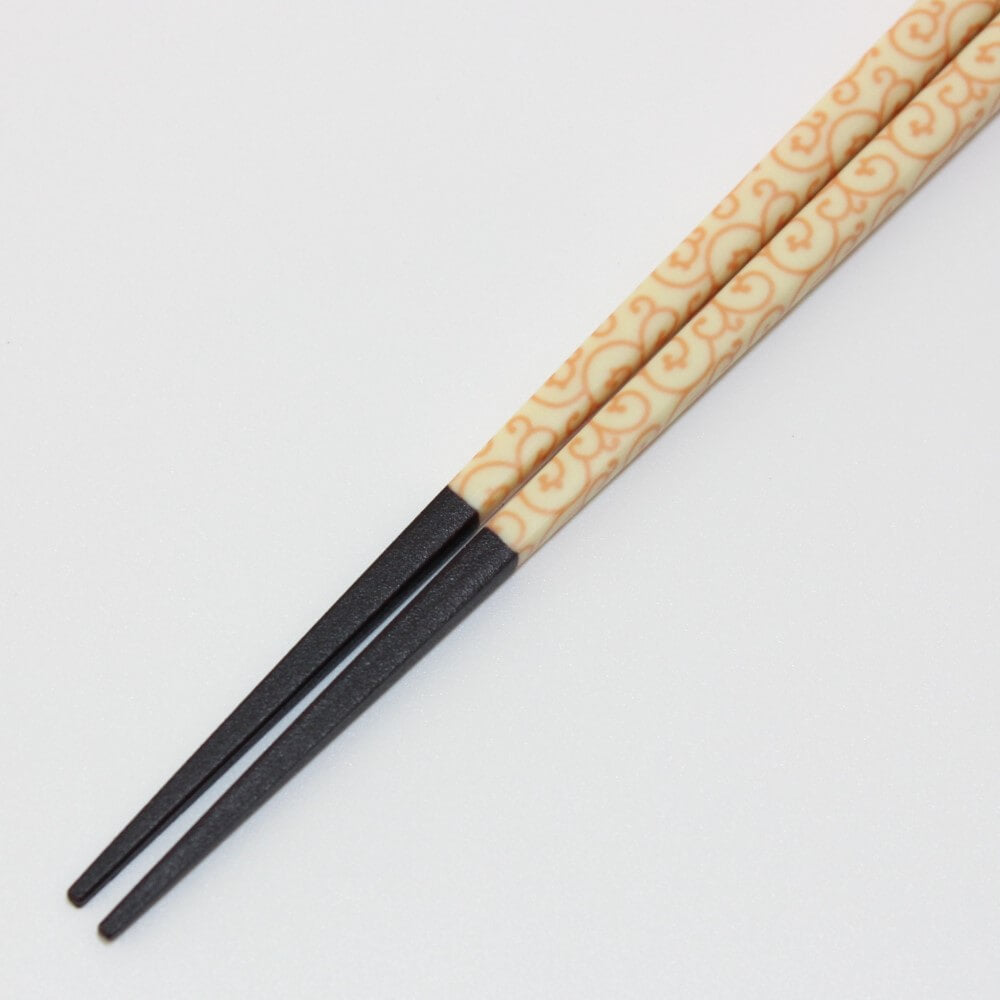 close up pointed tips karakusa yellow chopsticks