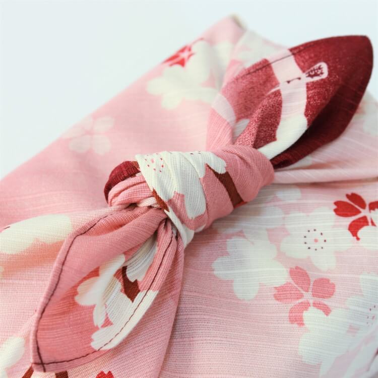 close up shot of tied knot of sakura scape furoshiki