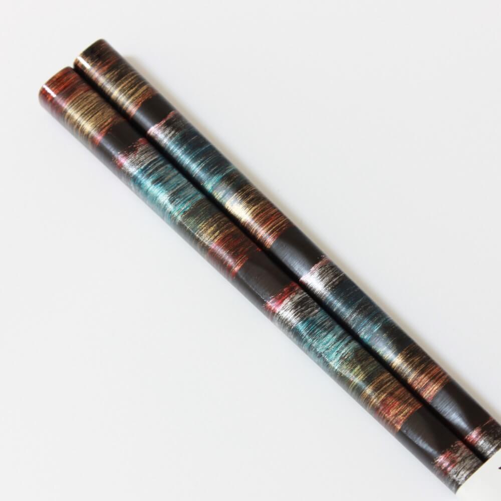 close-up-side-profile-wooden-chopsticks-ryuga-blue
