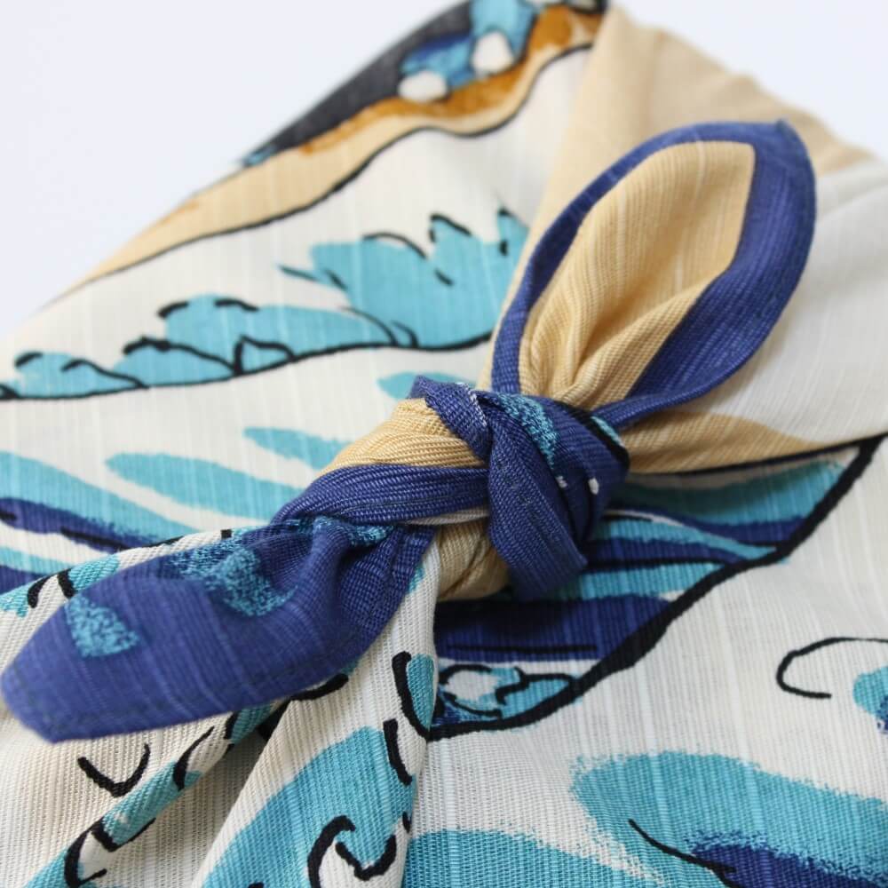 close up of tied knot of great wave and shiba inu furoshiki