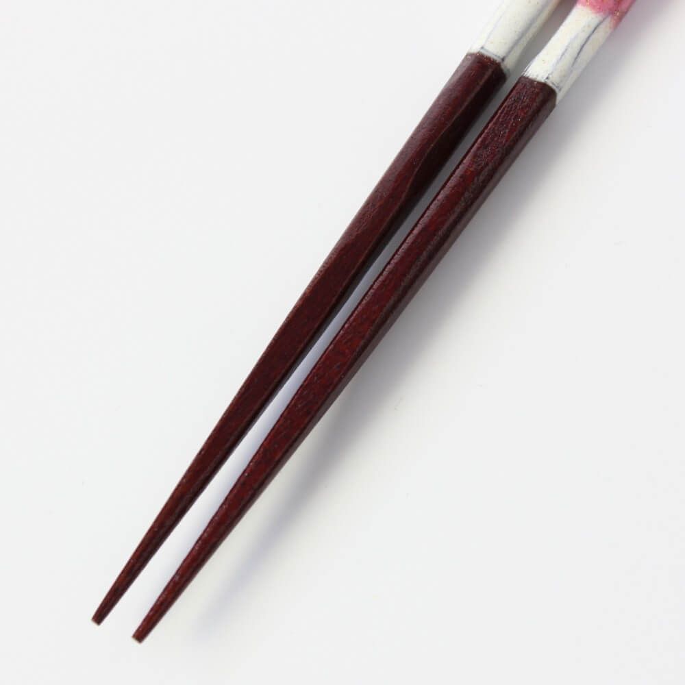 close up of the tips of the red yuushin chopsticks