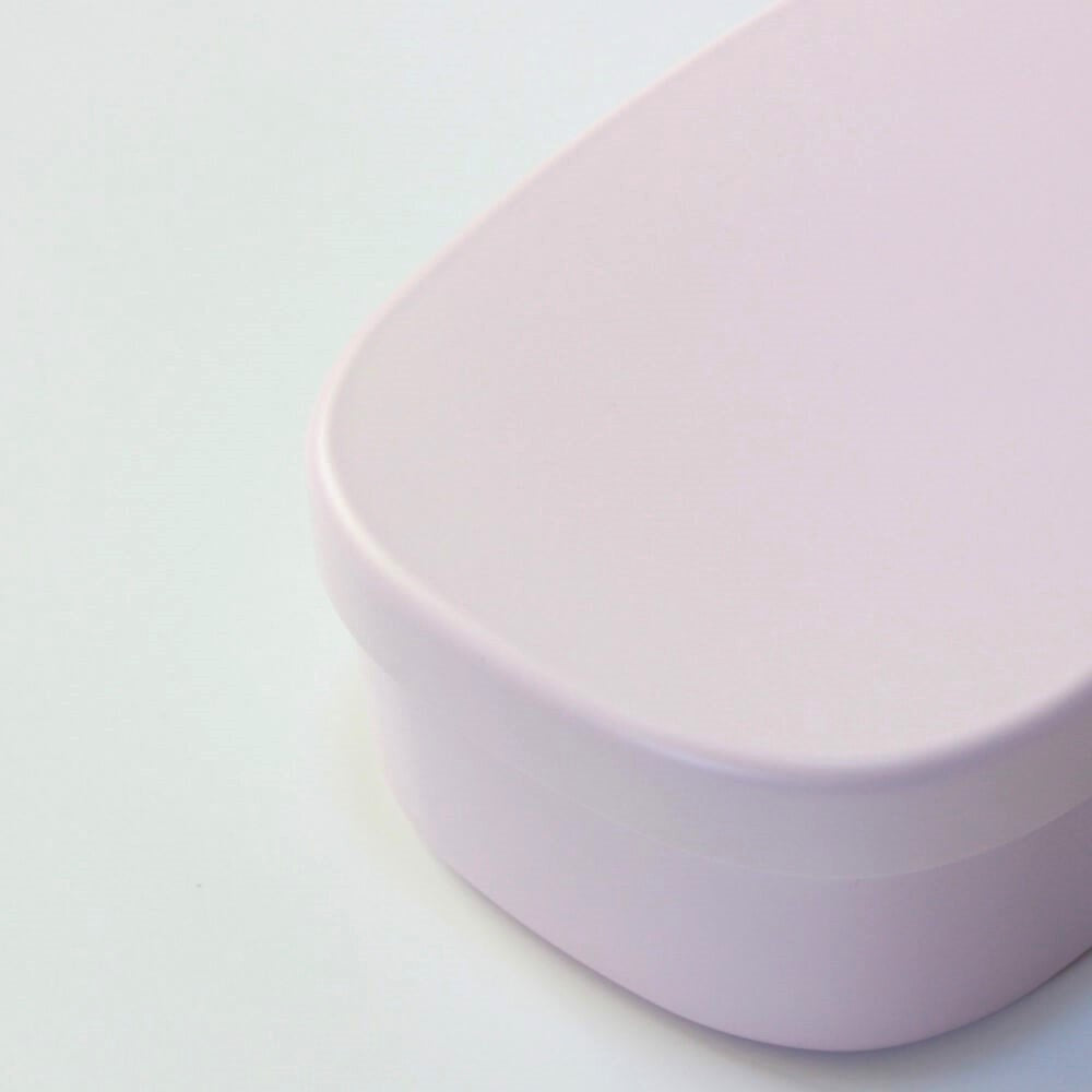 close up top of pink one touch bento box