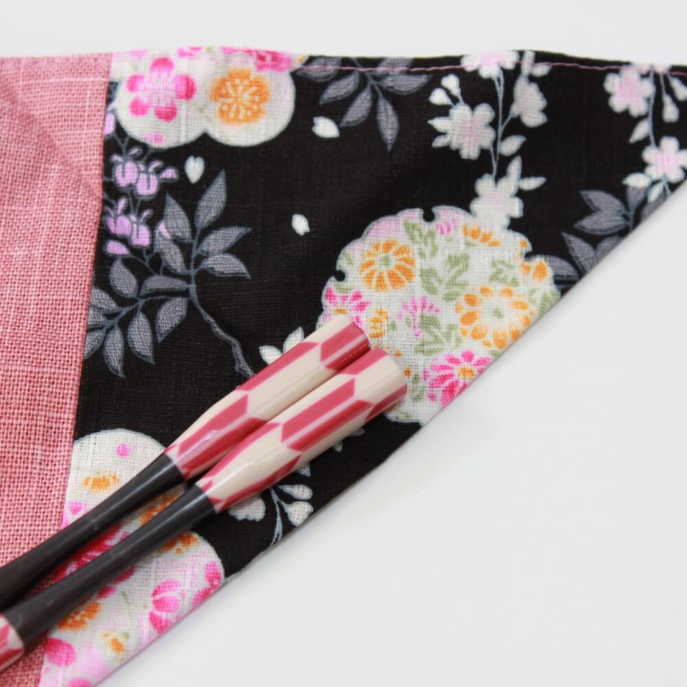 close up top portion chopsticks fabric case