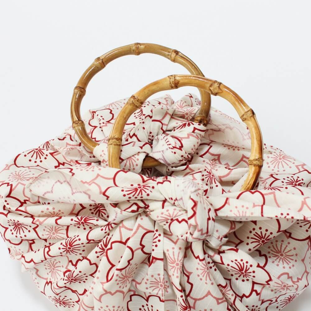 close up two bamboo ring handles furoshiki bag