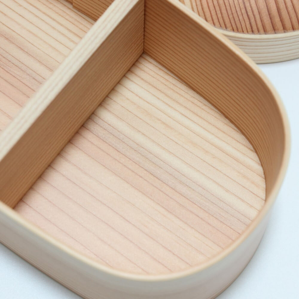 close up of the base of wooden bento box showing wood grains