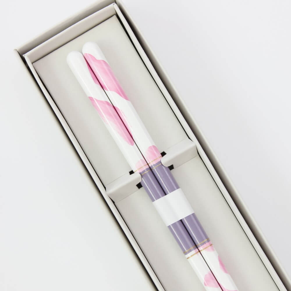 close up handles dolce fiore chopsticks in box