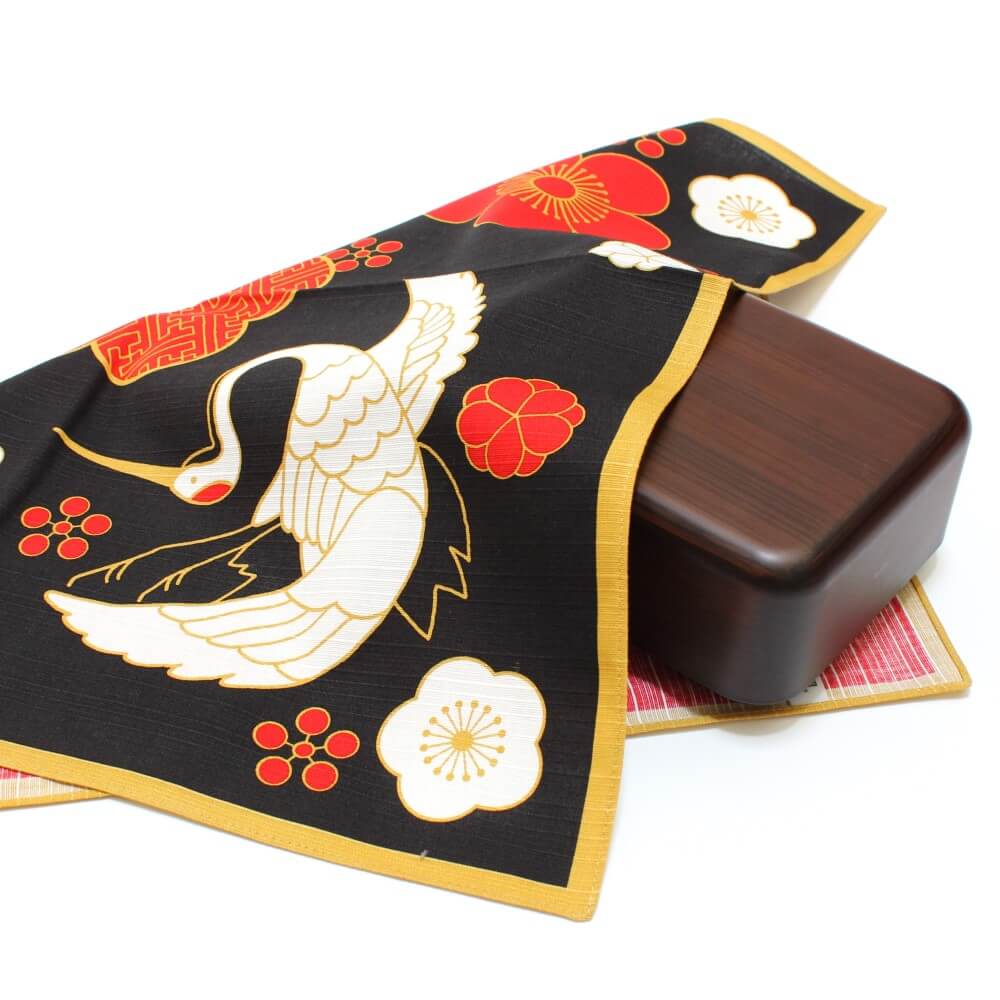 crane and turtle hama monyo furoshiki covering a brown bento box