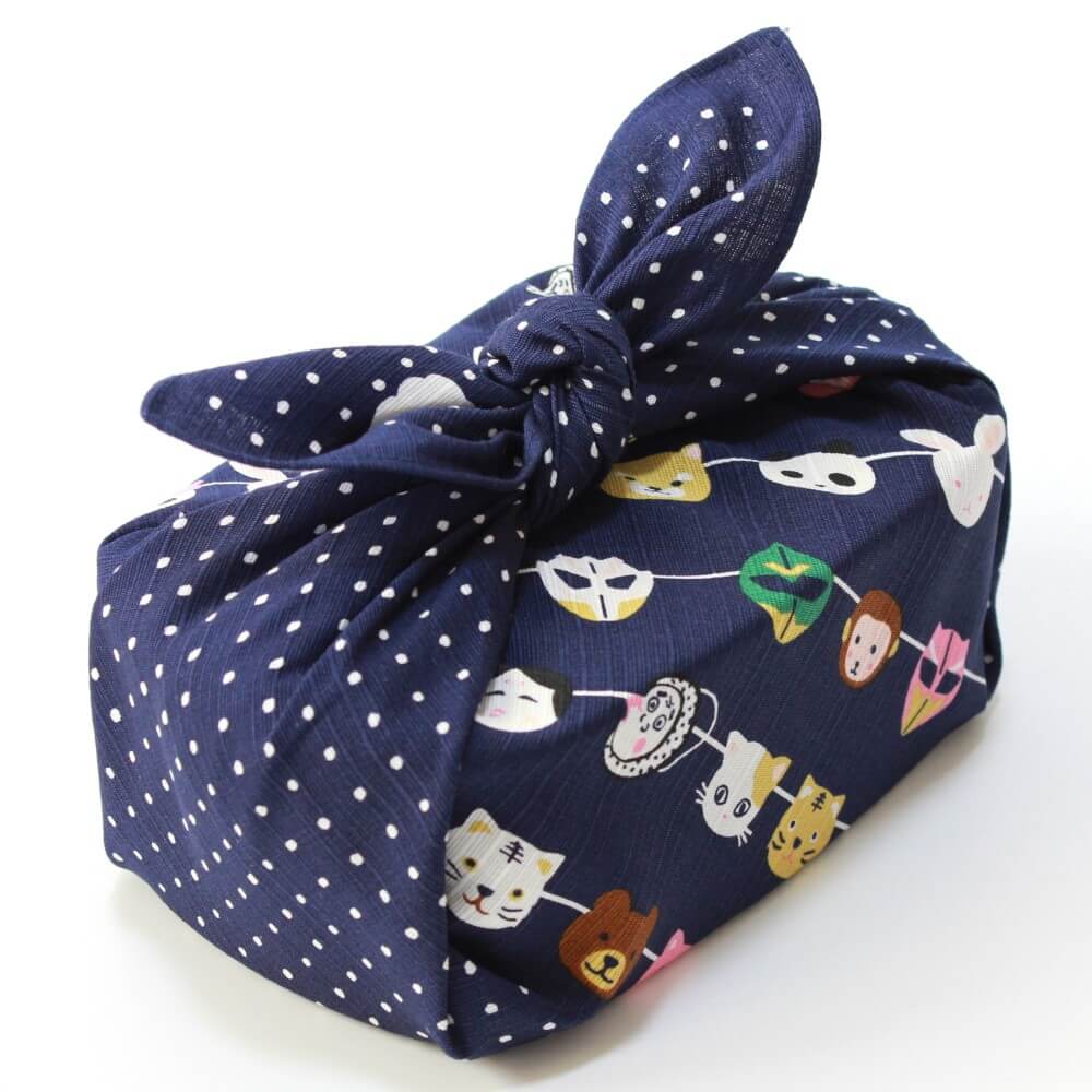 diagonal shot japanese masks furoshiki wrapped bento box