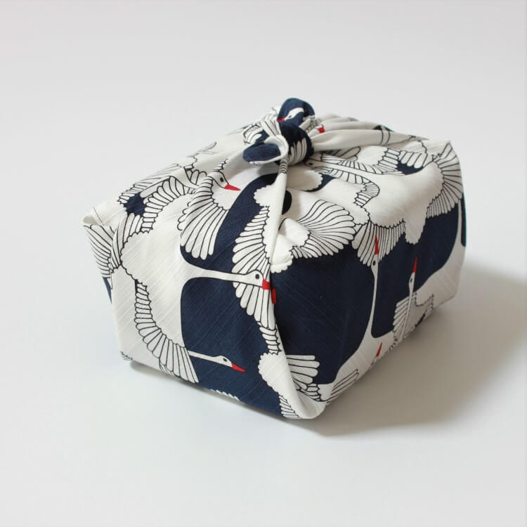 front side photo of bento box wrapped in celebration crane furoshiki