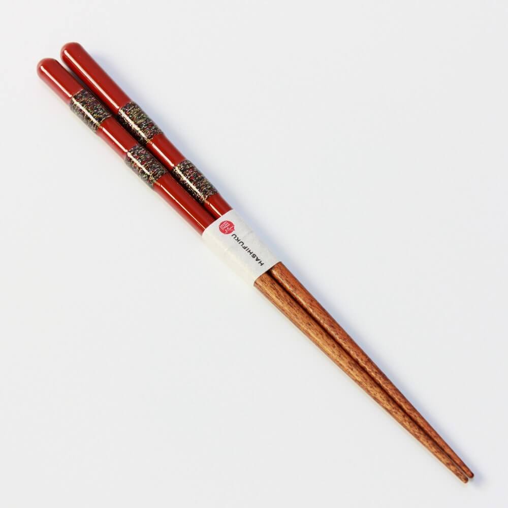 full length angled shot hananoito red wooden chopsticks