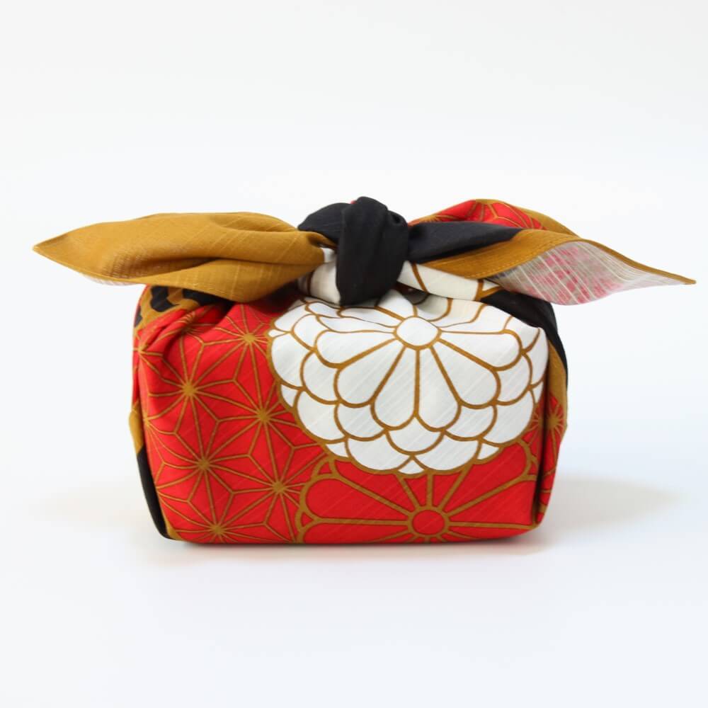 full side profile of bento box wrapped in the kiku nishiki furoshiki