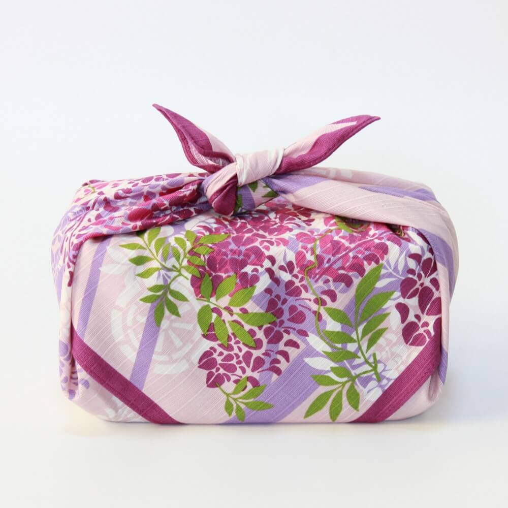full side profile bento box wrapped in wisteria trellis furoshiki