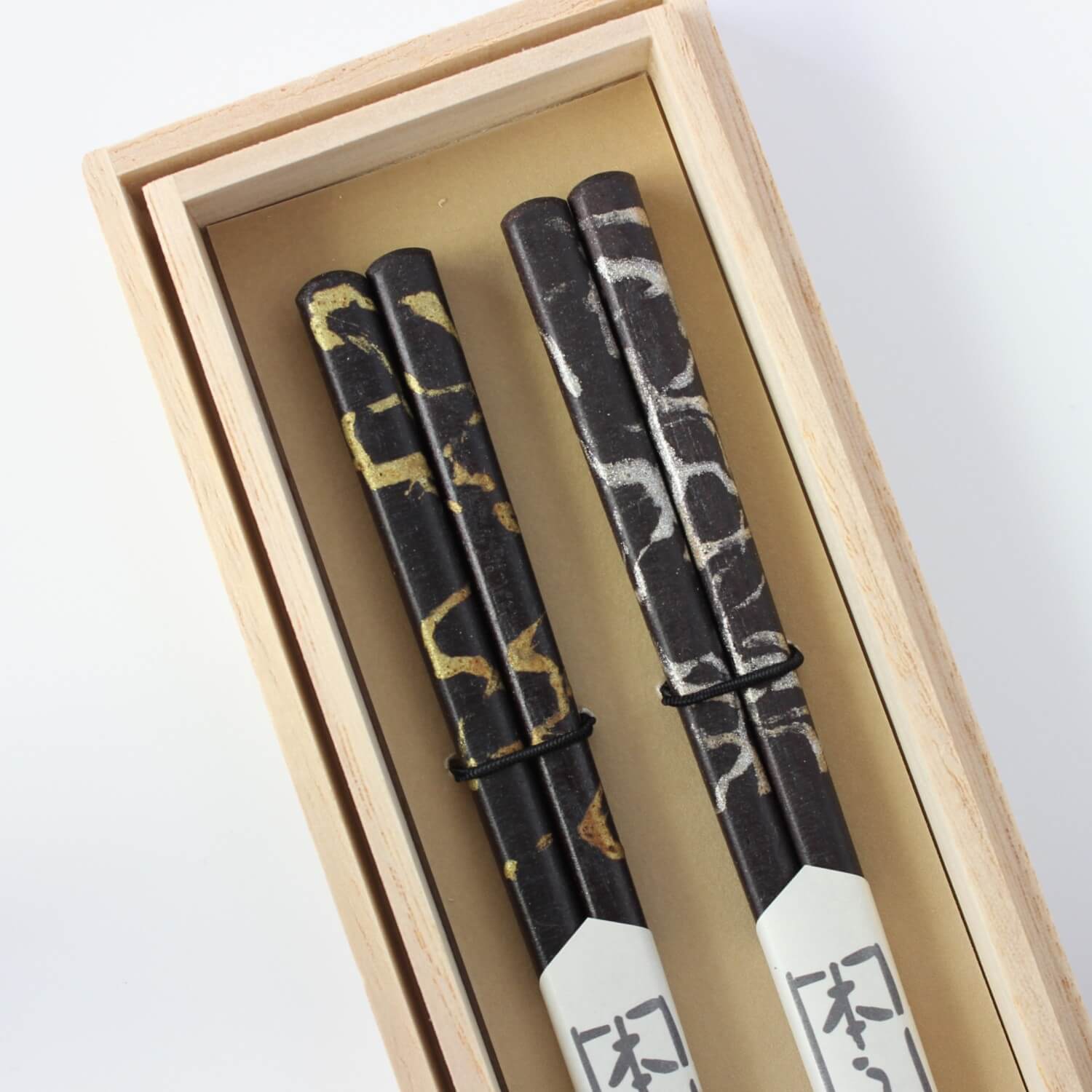 gold silver cloud chopsticks close up in gift box