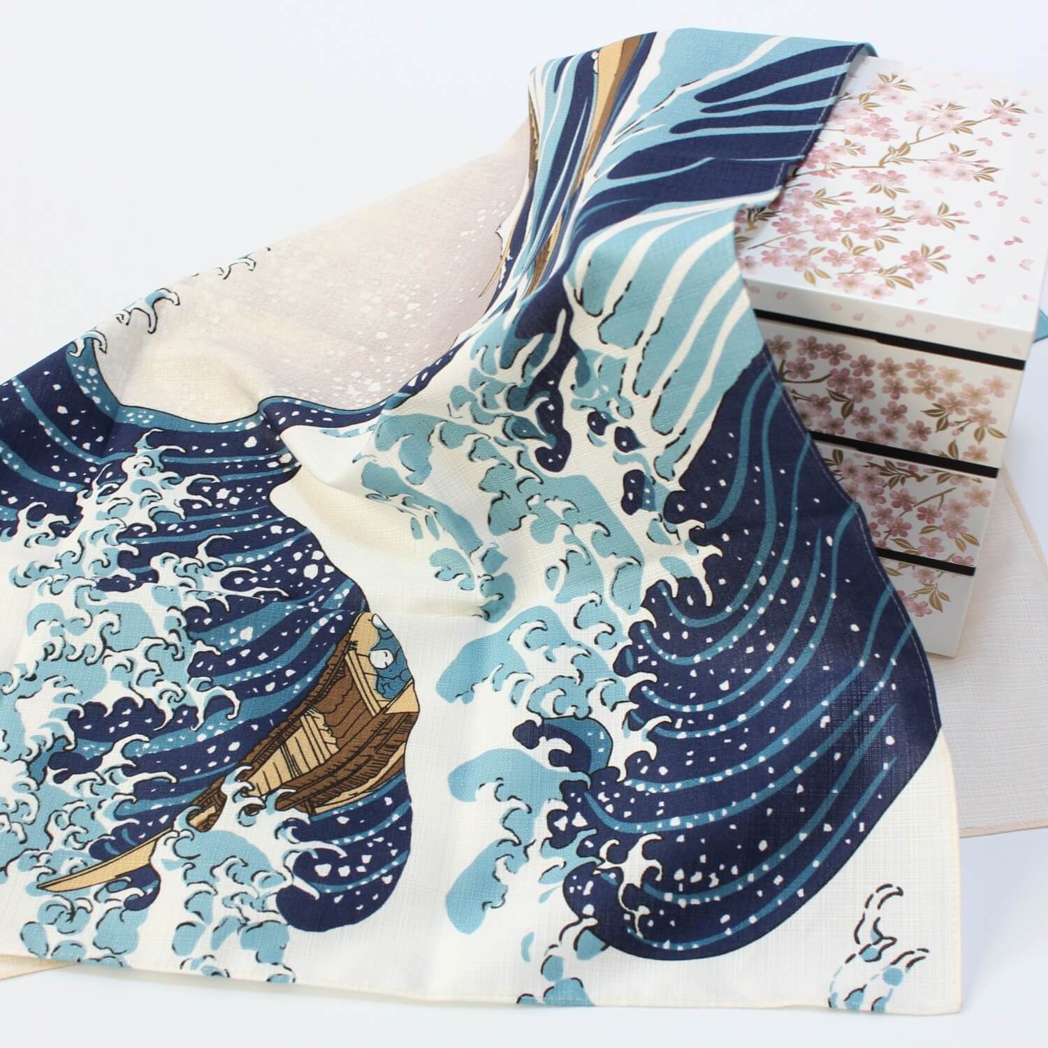 great wave furoshiki covering a jubako bento box