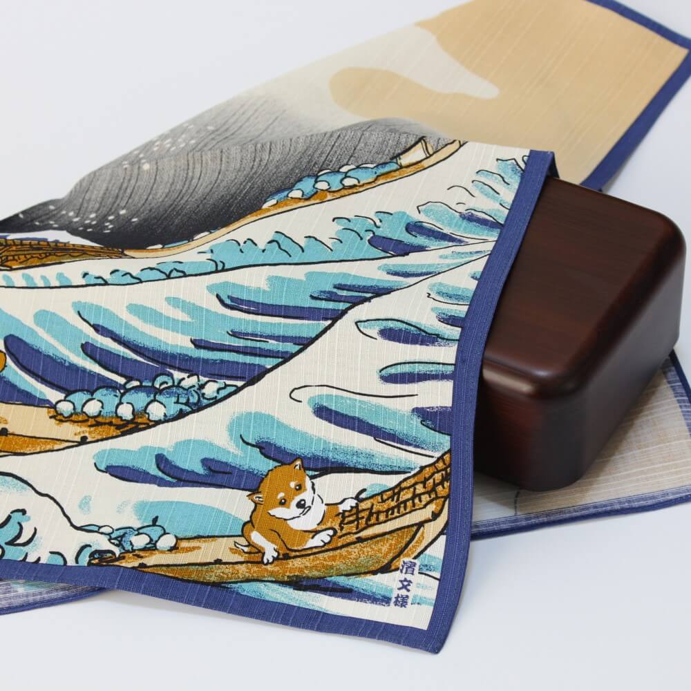 great wave and shiba inu furoshiki covering a brown bento box