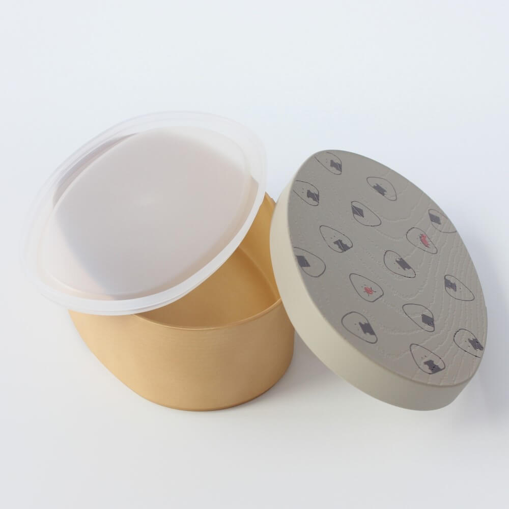 grey onigiri lid leaning against box