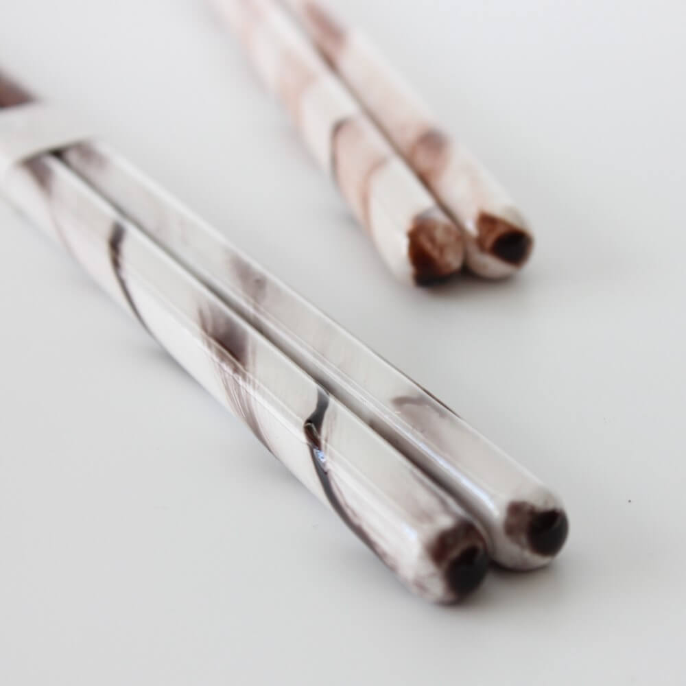 grey rukkora chopsticks in foreground