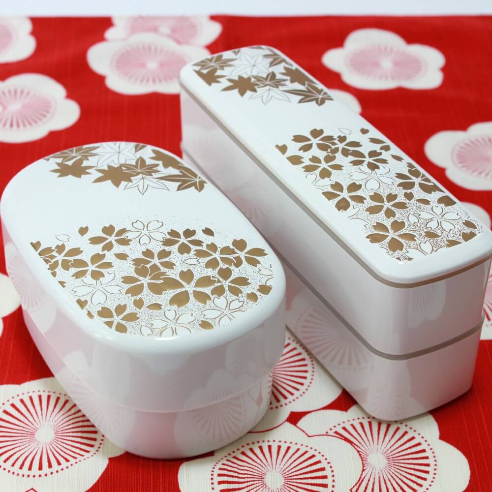 hanamaru white oval and slim bento boxes on red furoshiki