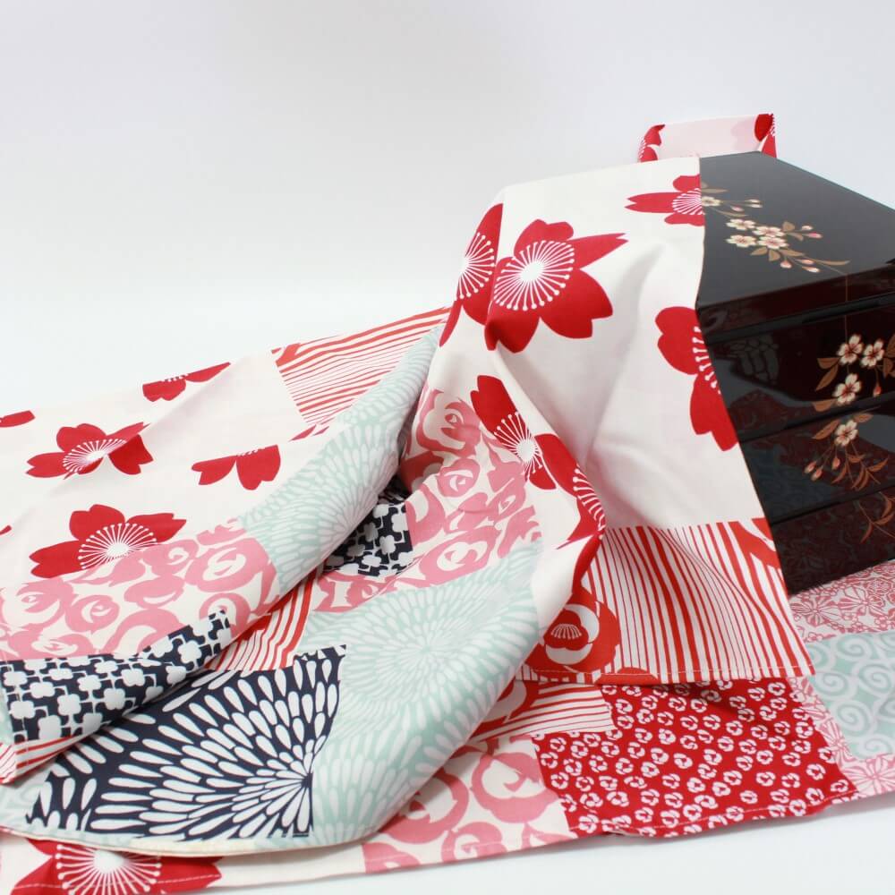 flower collage furoshiki around a picnic bento box