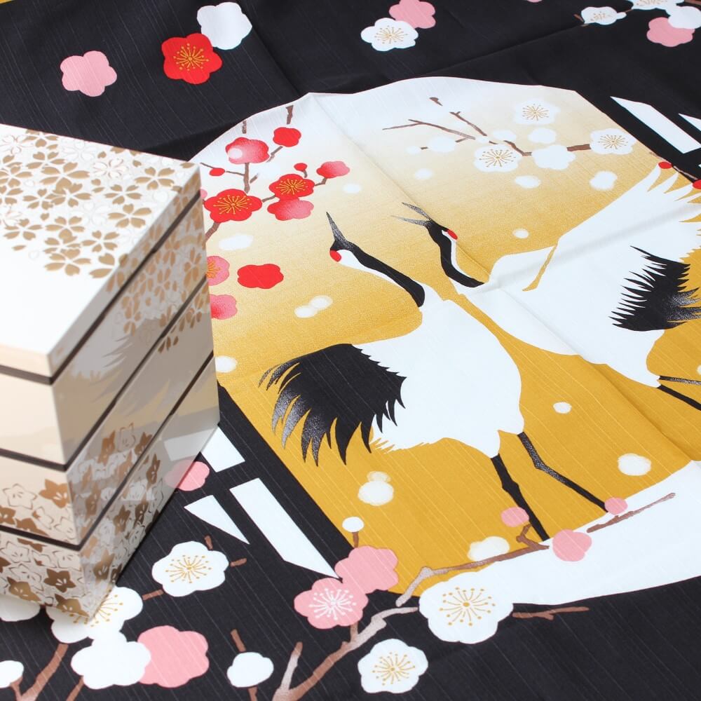 white jubako picnic bento box on the crane dance furoshiki from hamamonyo