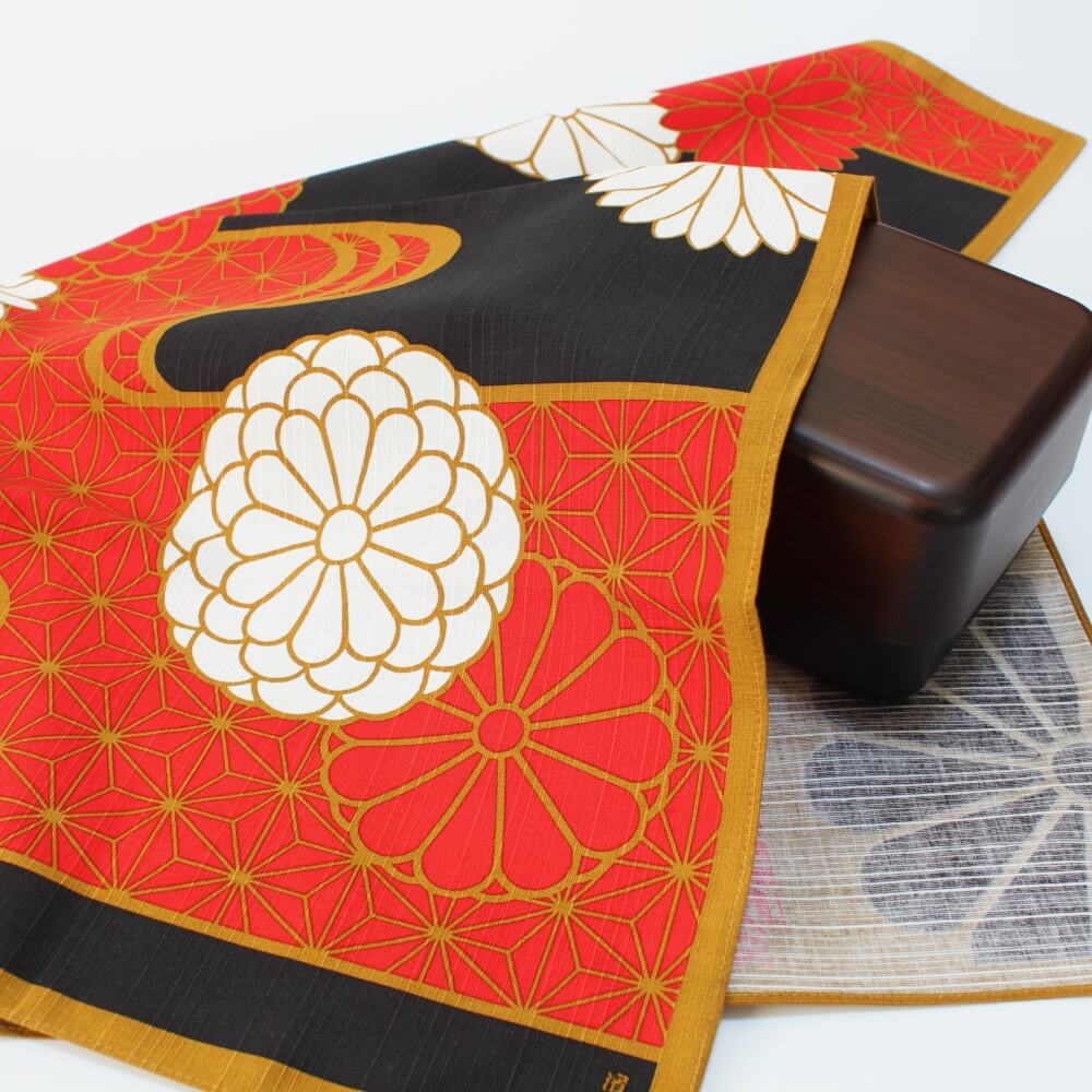 kiku nishiki red furoshiki from hama monyo covering a brown bento box