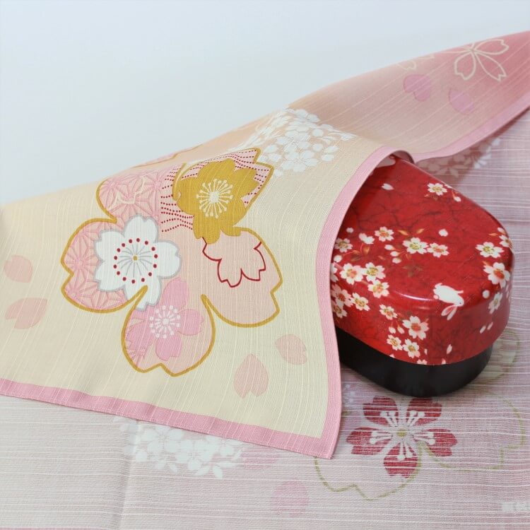 miyabi sakura furoshiki covering a red bento box