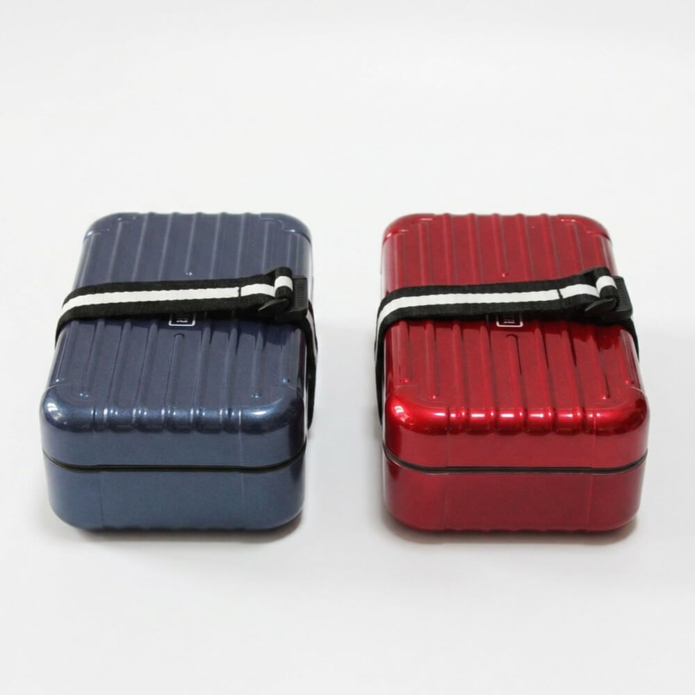 navy and red suitcase designed bento boxes side by side