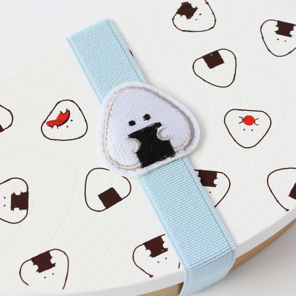 nori bento band over white onigiri bento box