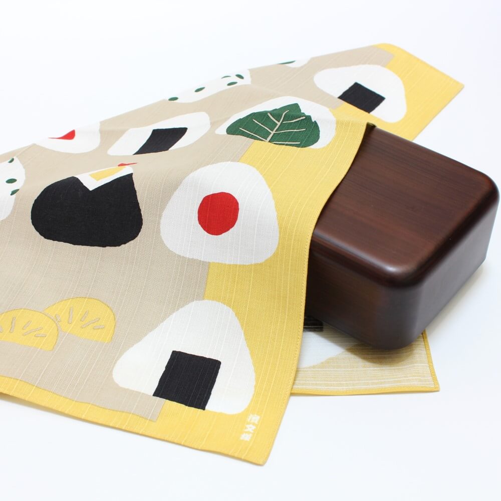 onigiri tsutsumi furoshiki covering a brown bento box