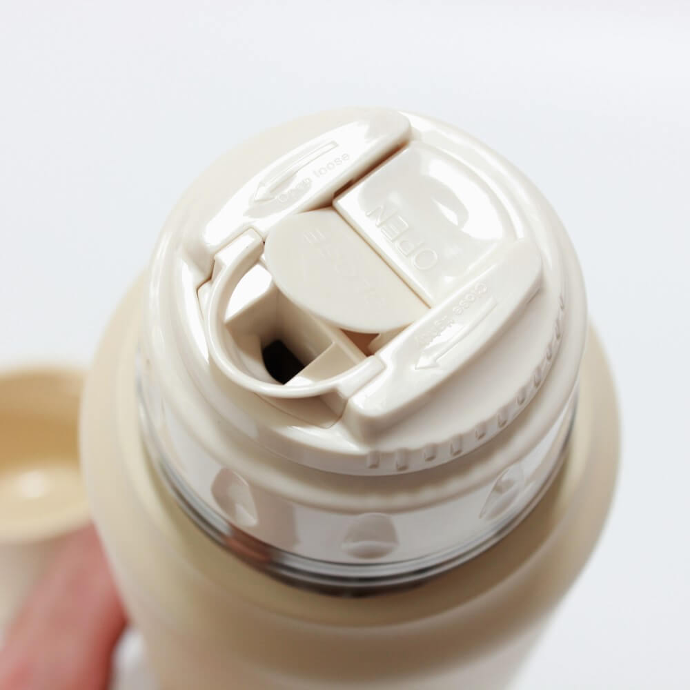 overhead shot showing opening inner cap 1000ml ivory trip bottle