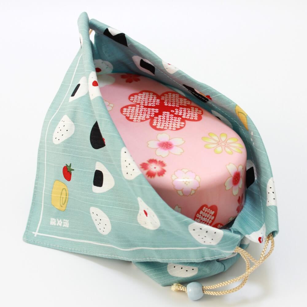 pink bento box inside onigiri bento lunch bag
