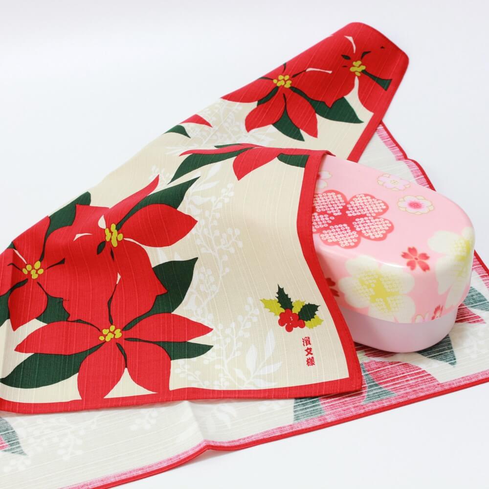 poinsettia red furoshiki covering pink bento box